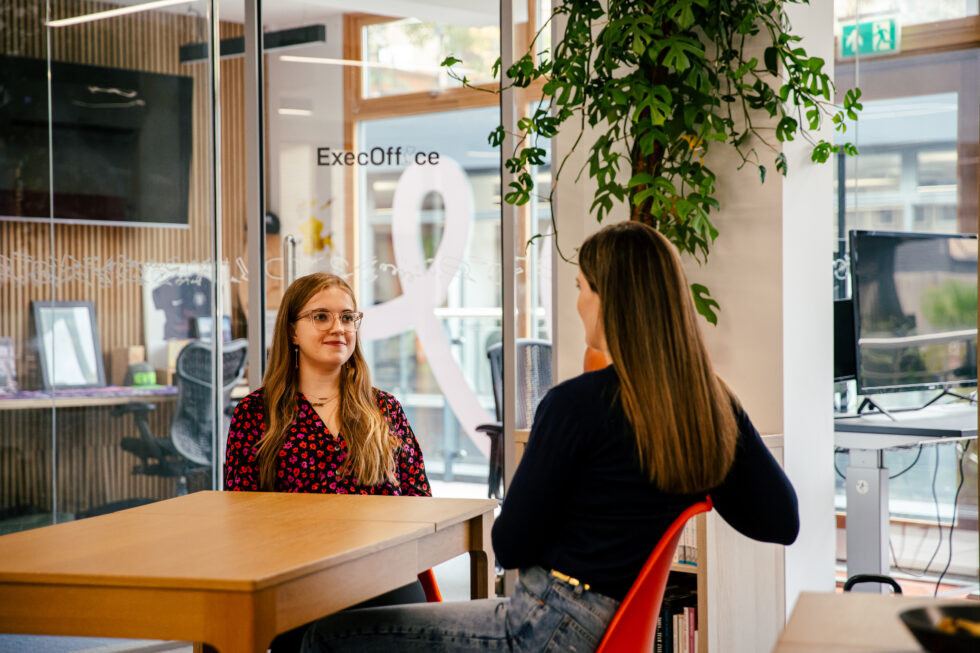 Milly Gladstone, this article's author, sat in the Cegos UK office, utilising soft skills in a conversation