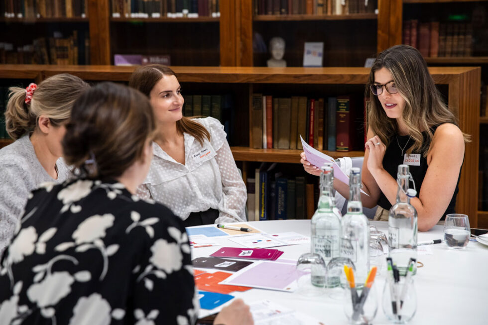 An L&D consultant working on a bespoke learning project in a group